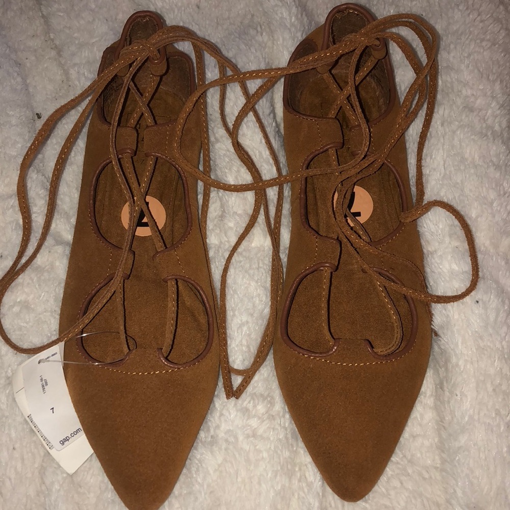 Brown tie up flats